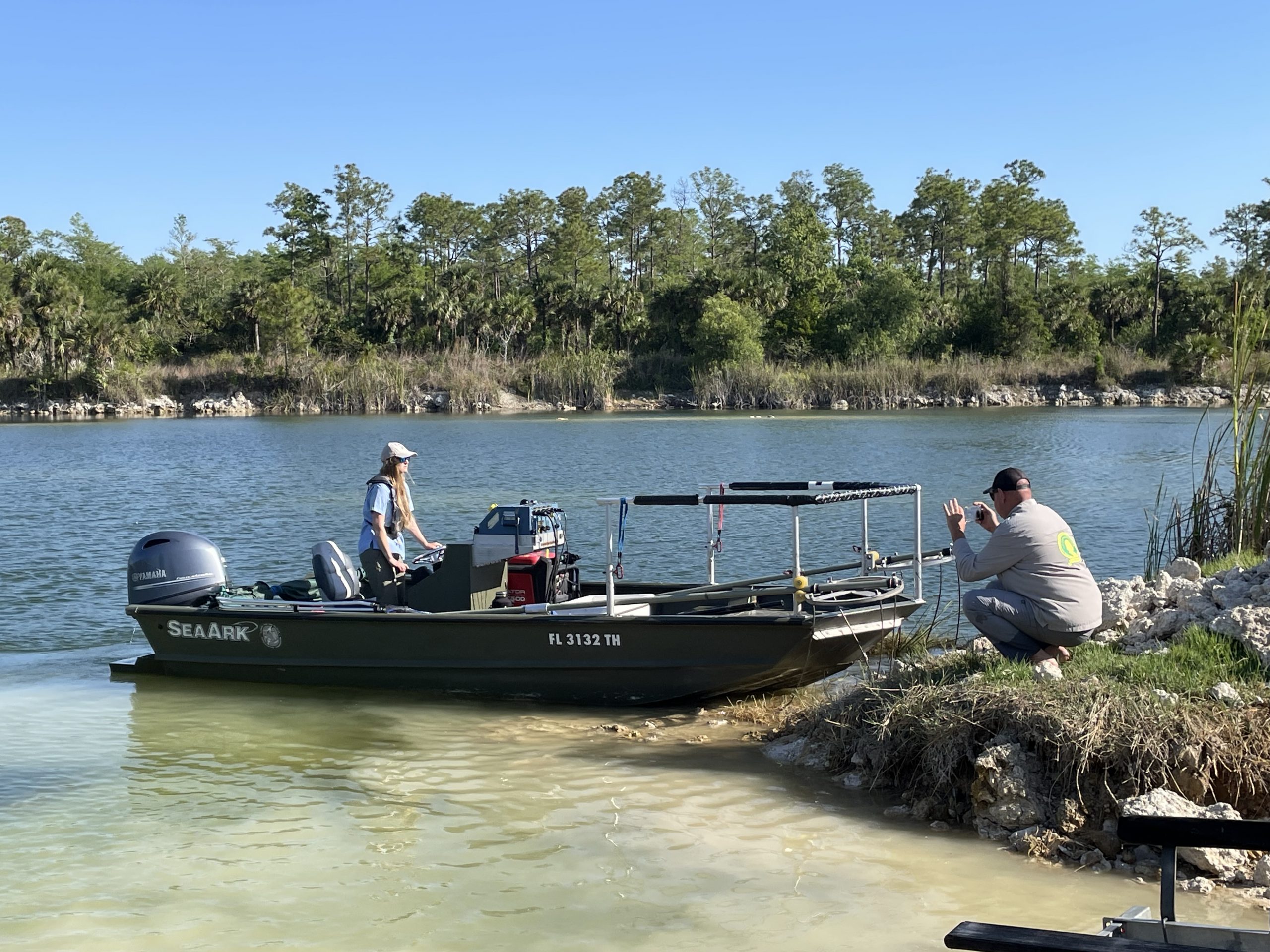 Captain Courtney putting electrofishing boat into Pistol Pond
